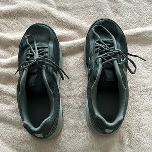 Men’s New Balance running shoes.  Style 1540.  Size 11 4E.  Black / Castlerock.